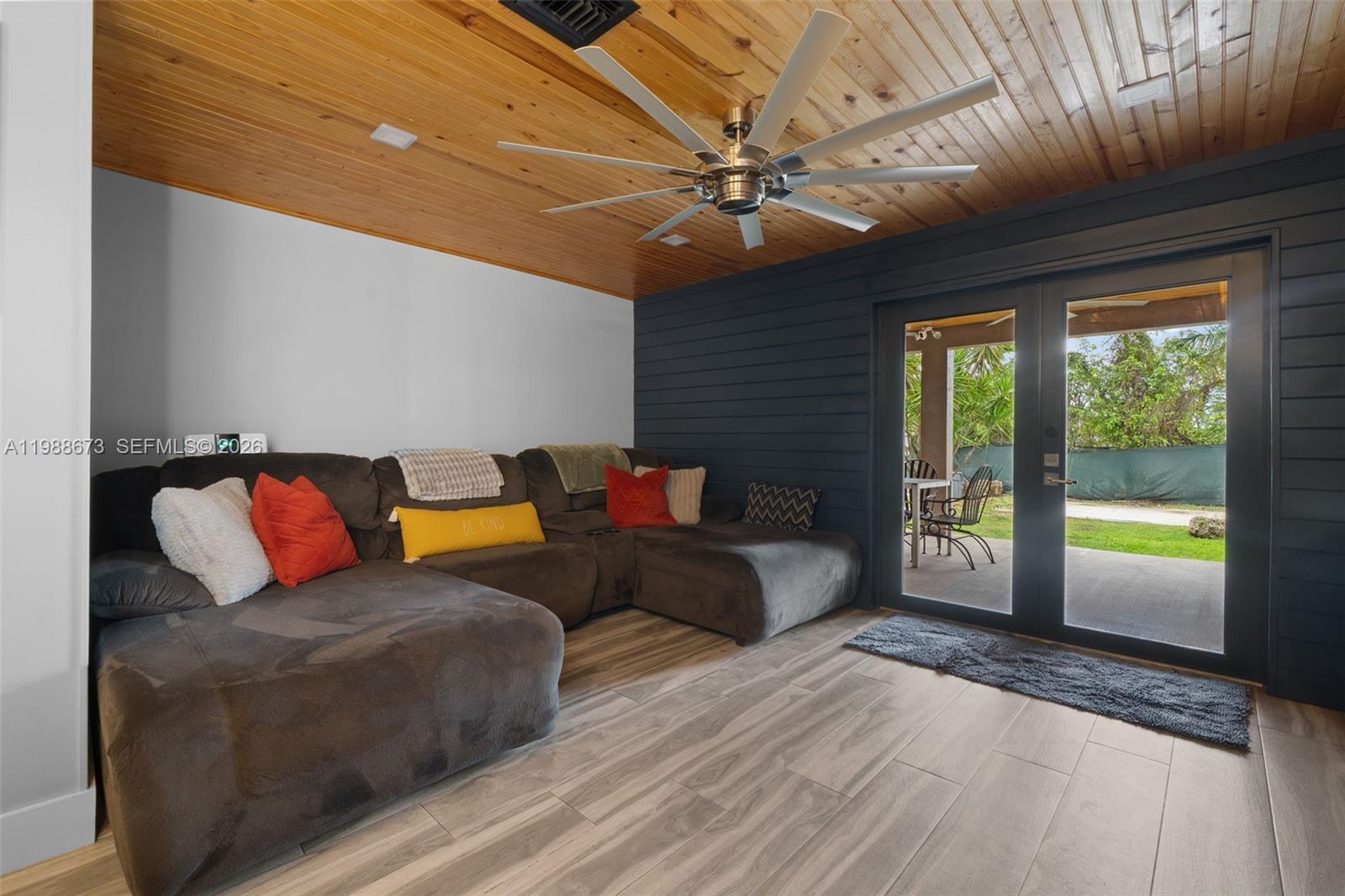 14888 Southwest 140th Street Miami, FL 33196 - Photo 48 of 76 a living room with furniture and a large window