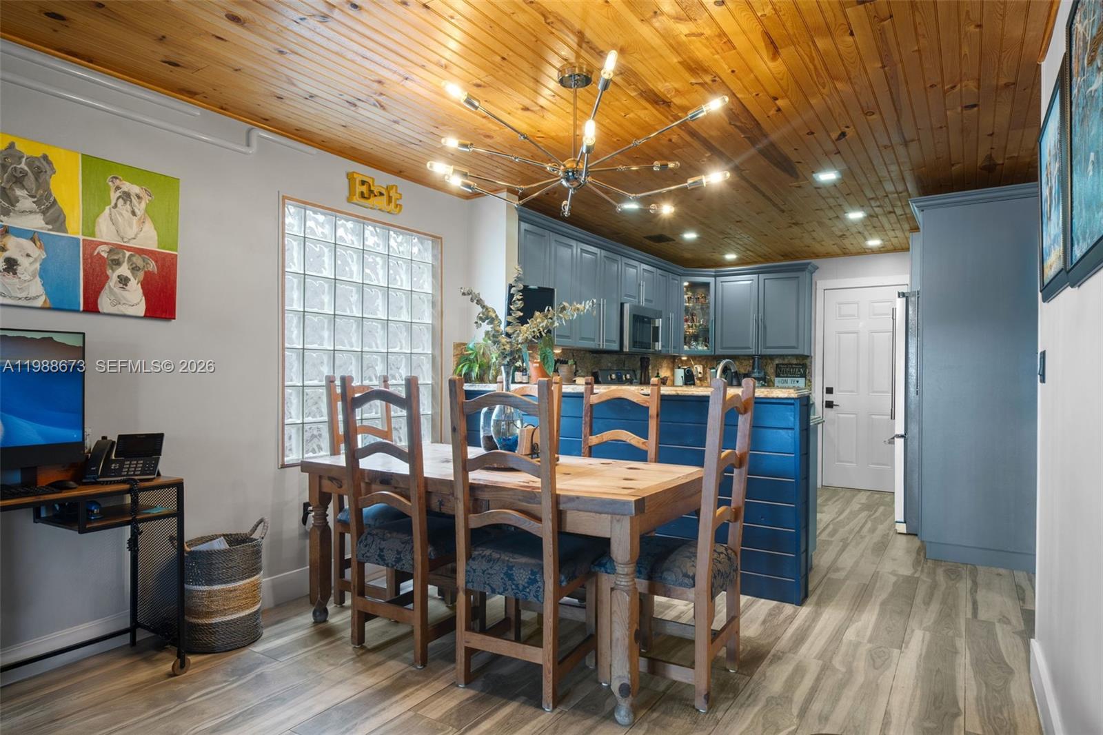 14888 Southwest 140th Street Miami, FL 33196 - Photo 50 of 76 a view of a dining room with furniture window and wooden floor