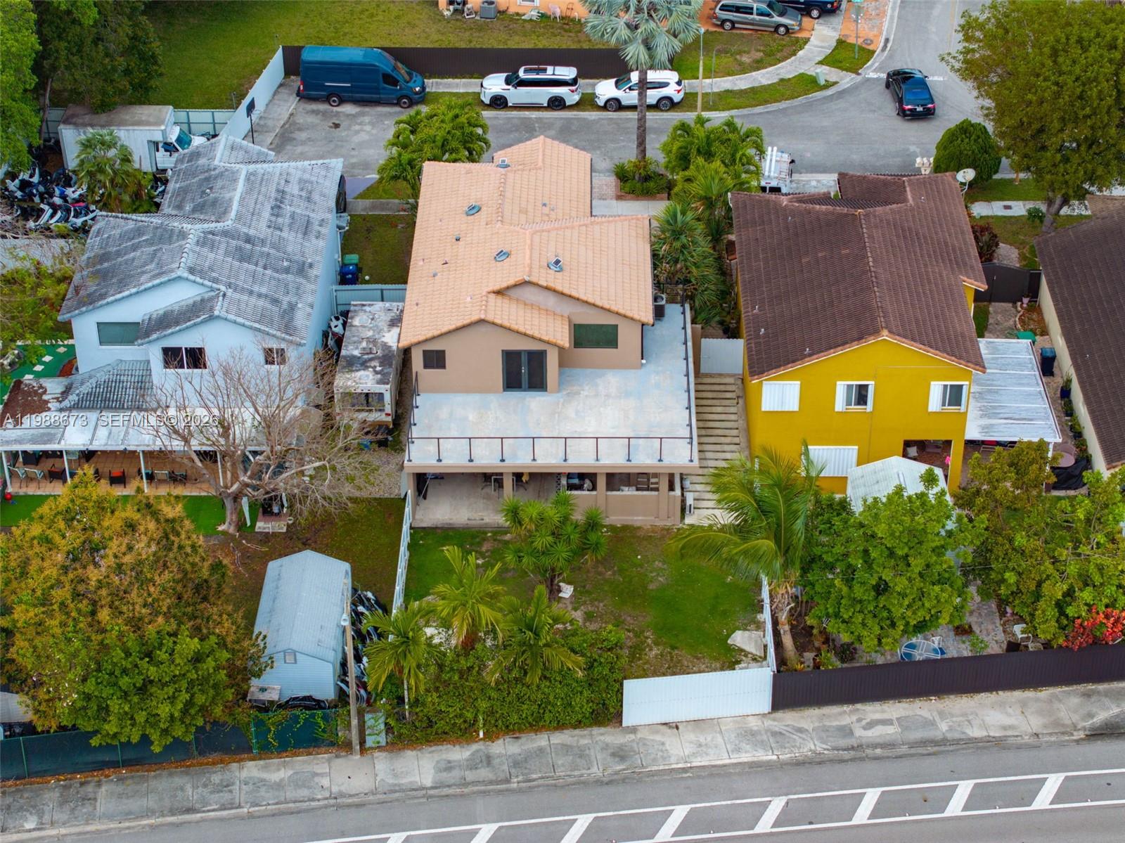 14888 Southwest 140th Street Miami, FL 33196 - Photo 62 of 76 an aerial view of a house with a yard and garden