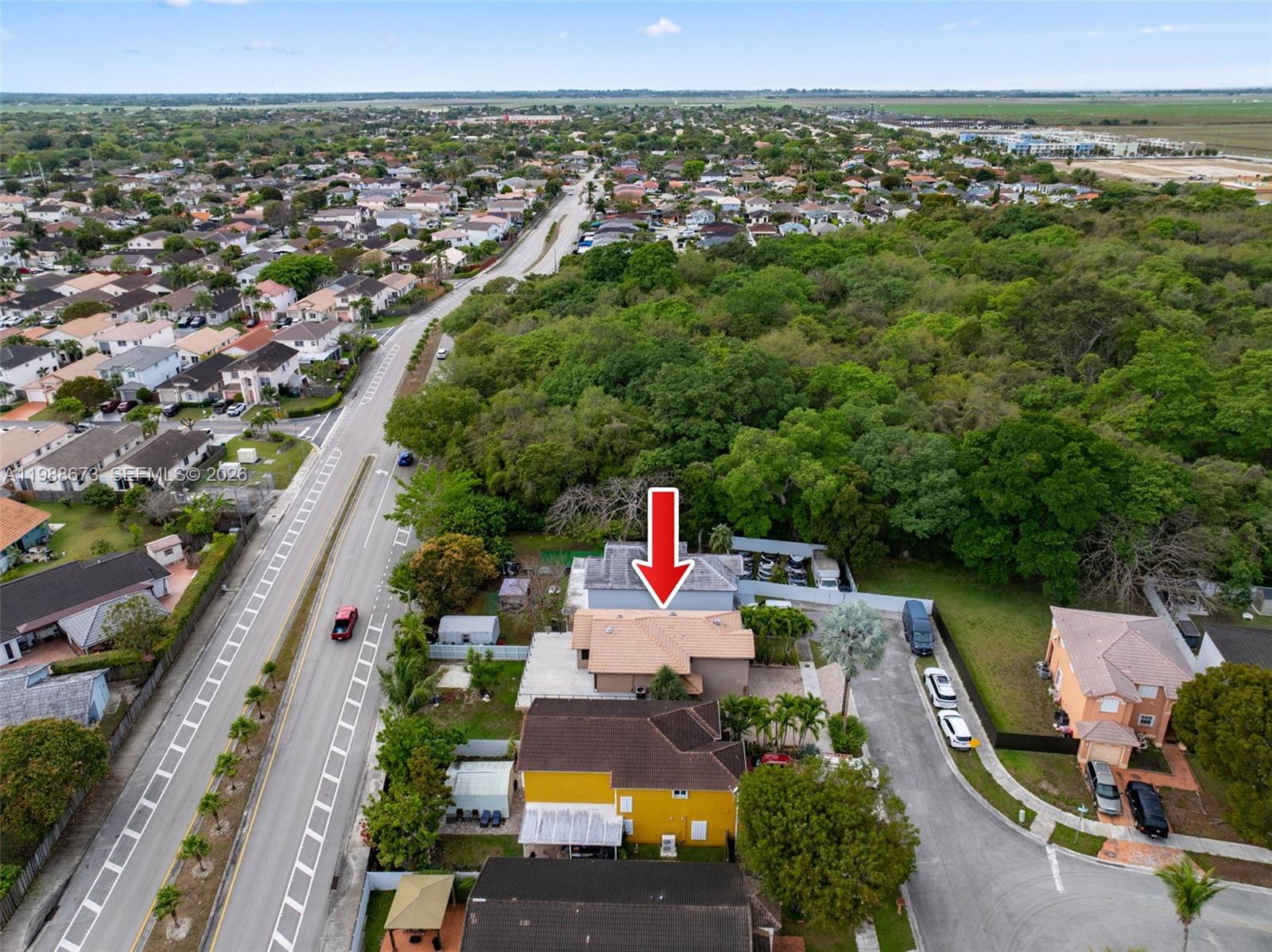 14888 Southwest 140th Street Miami, FL 33196 - Photo 65 of 76 an aerial view of a house with a yard