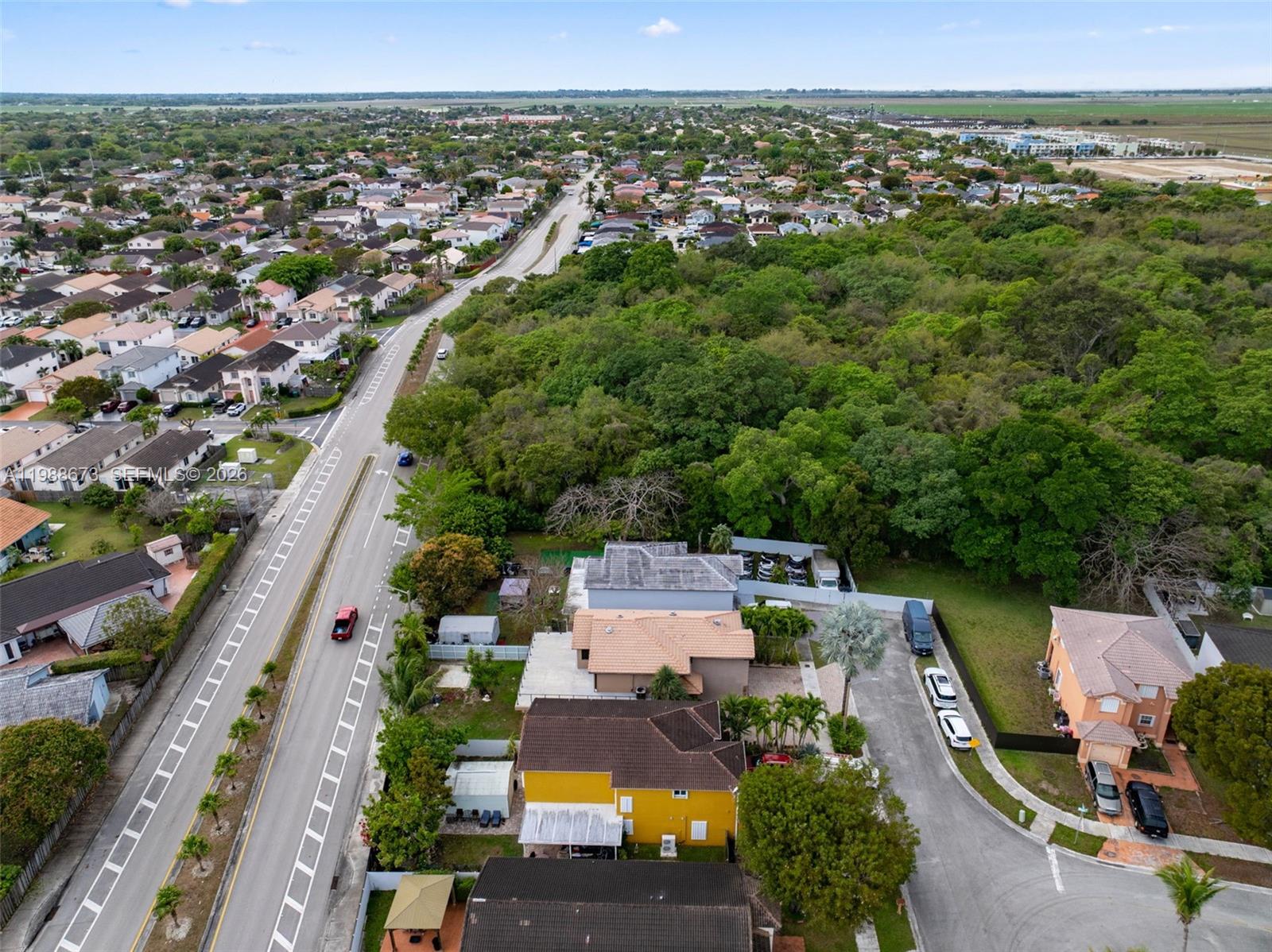 14888 Southwest 140th Street Miami, FL 33196 - Photo 66 of 76 an aerial view of a city with lots of residential buildings