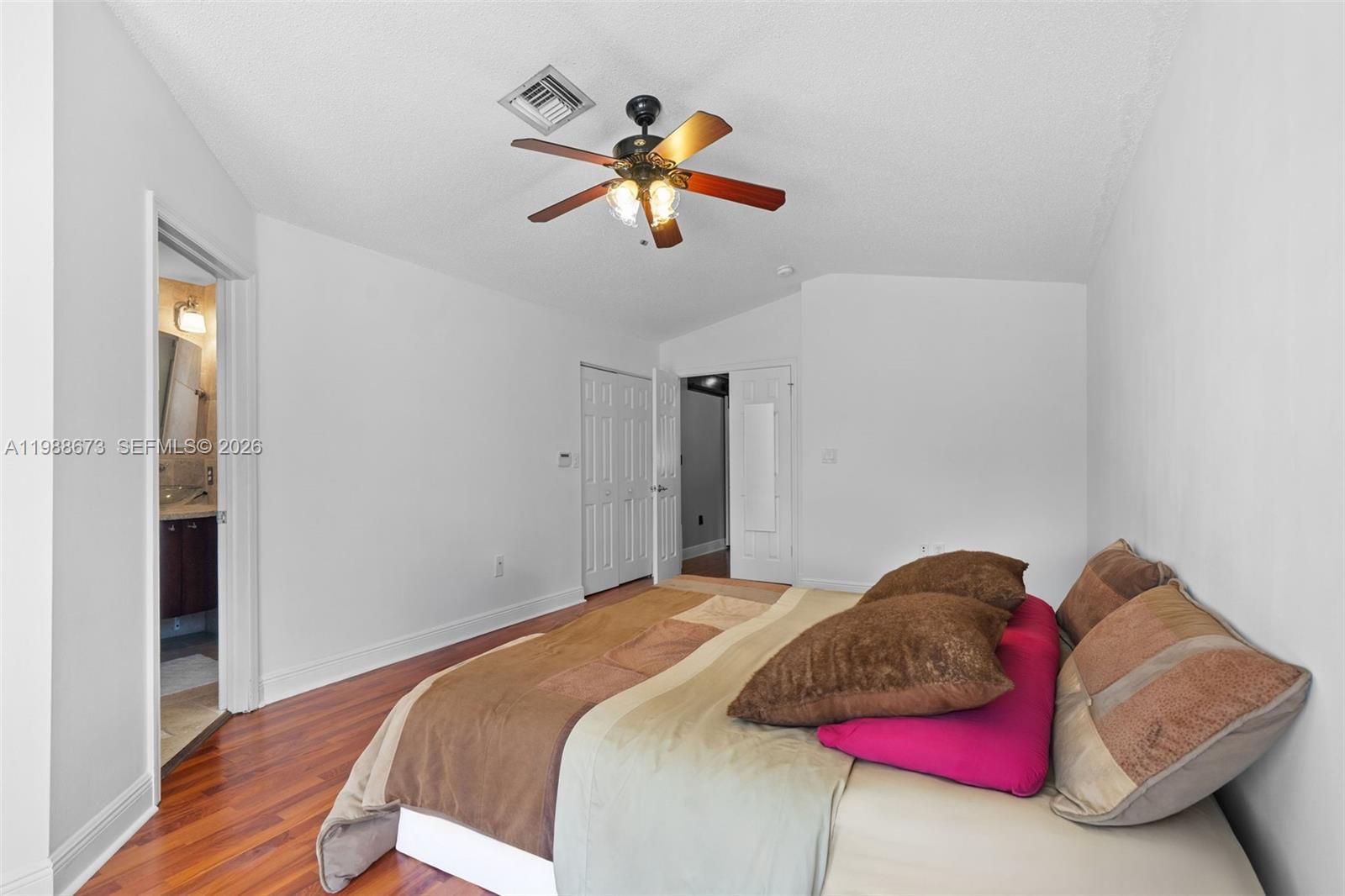 14888 Southwest 140th Street Miami, FL 33196 - Photo 7 of 76 a bedroom with a bed and window