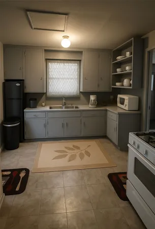 a kitchen with a cabinets and steel stainless steel appliances