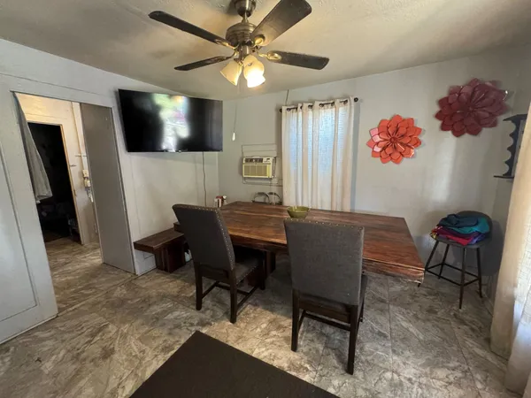 a workspace with a couch and a flat screen tv