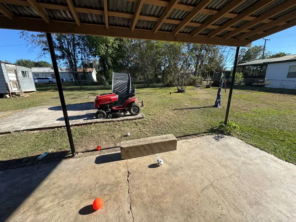 a view of a backyard with wooden floor
