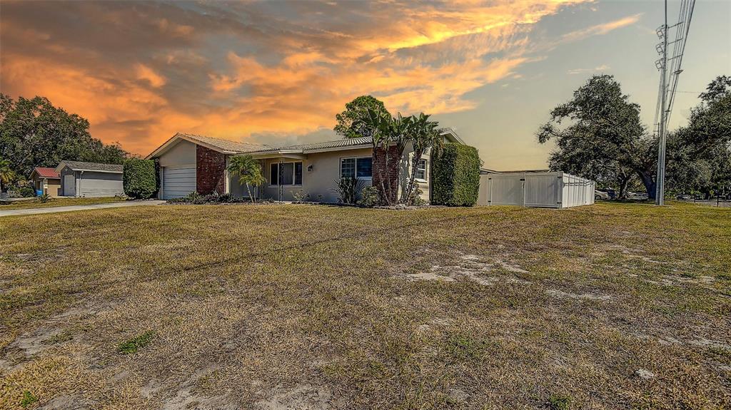 8601 139th Street Seminole, FL 33776 - Photo 12 of 47 a view of a house with a yard