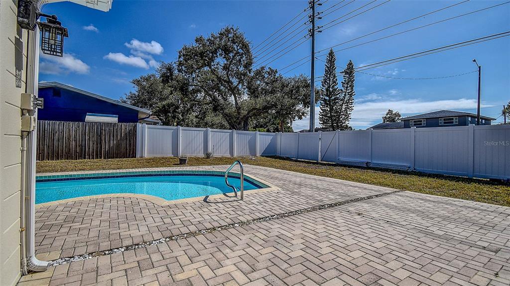 8601 139th Street Seminole, FL 33776 - Photo 15 of 47 a view of a backyard with swimming pool