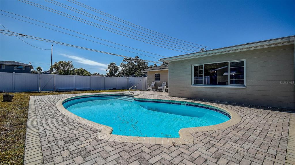 8601 139th Street Seminole, FL 33776 - Photo 20 of 47 a view of outdoor space yard swimming pool and furniture