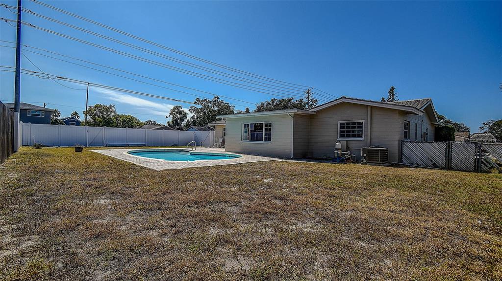 8601 139th Street Seminole, FL 33776 - Photo 21 of 47 a view of a house with a yard