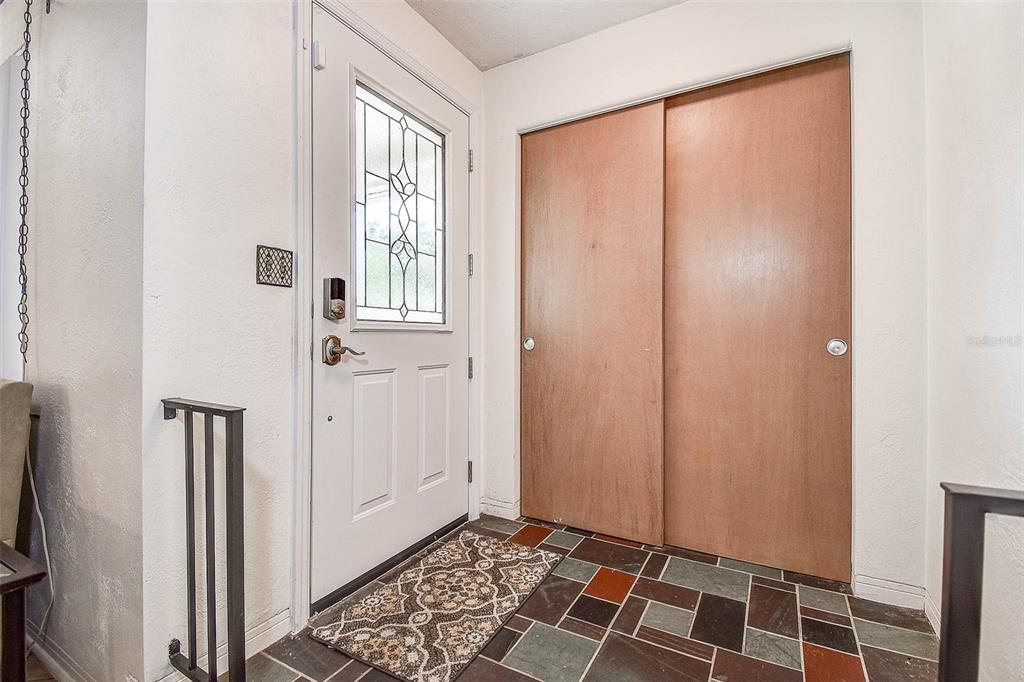8601 139th Street Seminole, FL 33776 - Photo 23 of 47 a view of an empty room with wooden floor and a window