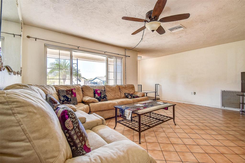 8601 139th Street Seminole, FL 33776 - Photo 25 of 47 a living room with furniture and a large window