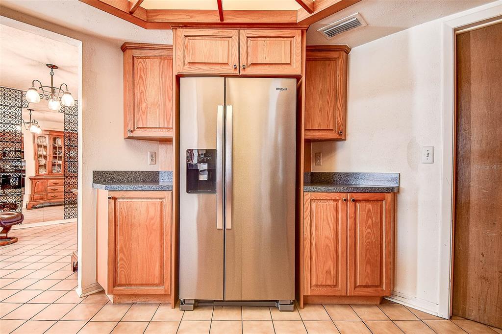 8601 139th Street Seminole, FL 33776 - Photo 30 of 47 a kitchen with stainless steel appliances granite countertop a refrigerator and a window