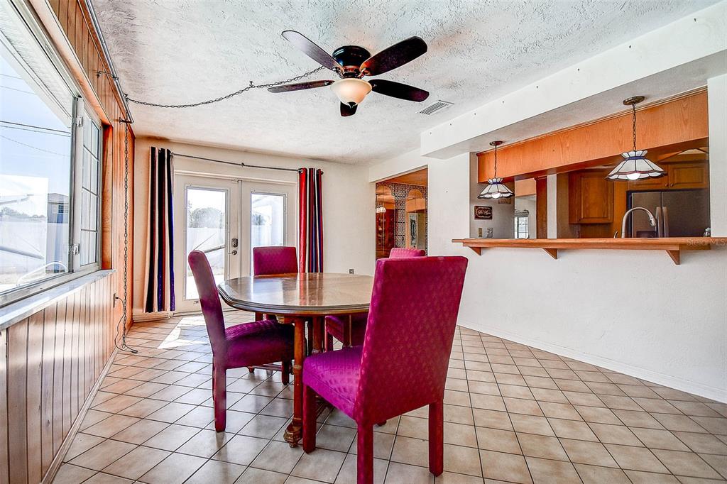 8601 139th Street Seminole, FL 33776 - Photo 35 of 47 a view of a dining room with furniture window and wooden floor