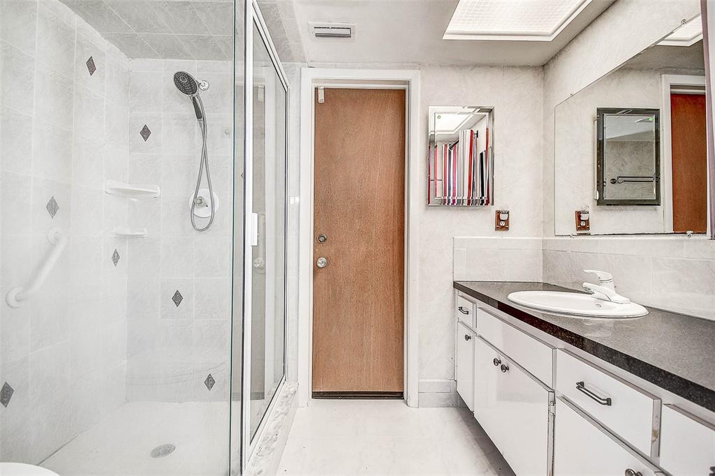 8601 139th Street Seminole, FL 33776 - Photo 39 of 47 a bathroom with a double vanity sink mirror and shower