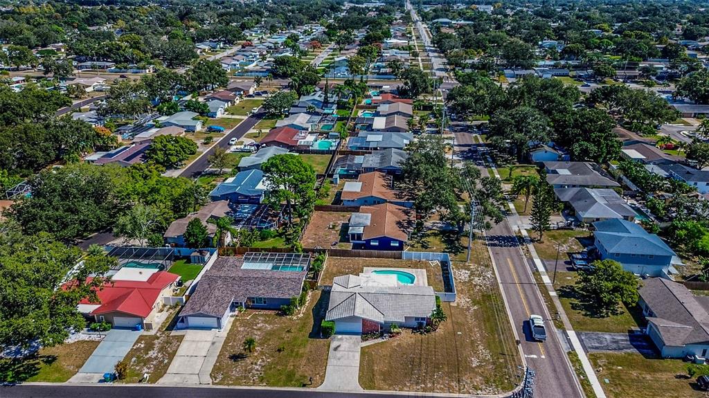 8601 139th Street Seminole, FL 33776 - Photo 4 of 47 an aerial view of a houses with swimming pool