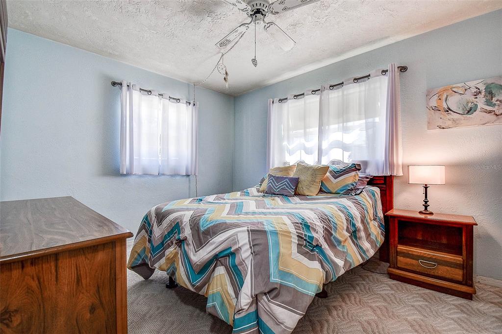 8601 139th Street Seminole, FL 33776 - Photo 42 of 47 a bedroom with a bed and a window