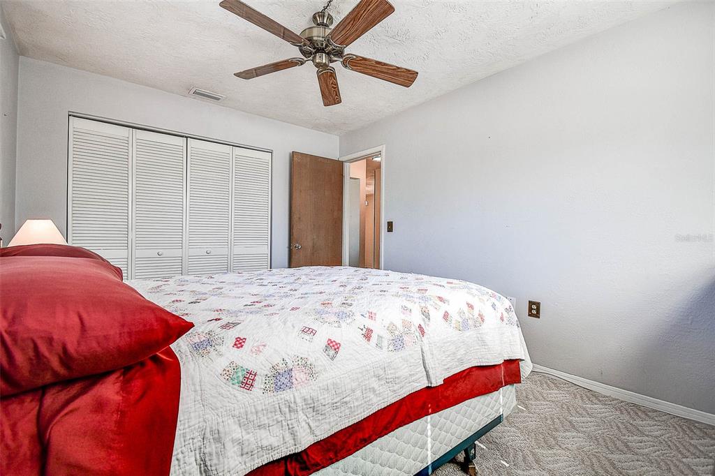 8601 139th Street Seminole, FL 33776 - Photo 45 of 47 a bedroom with a bed and window