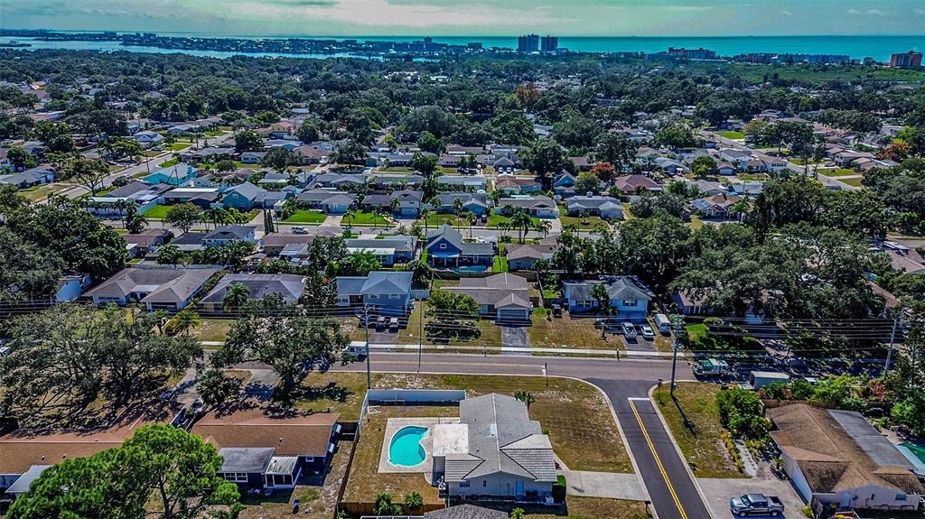 8601 139th Street Seminole, FL 33776 - Photo 7 of 47 an aerial view of a house with a swimming pool outdoor seating and yard