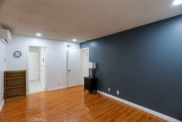 a view of a house with backyard and a garden