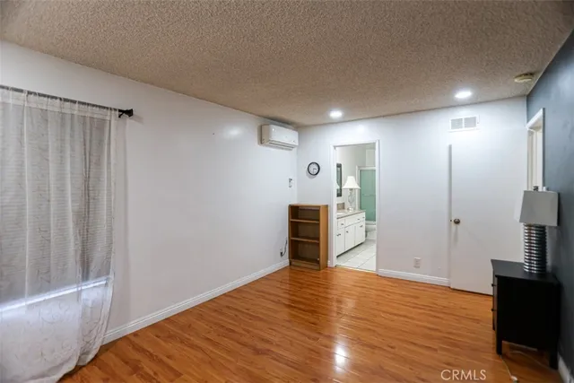 a view of a pathway with a house in the background