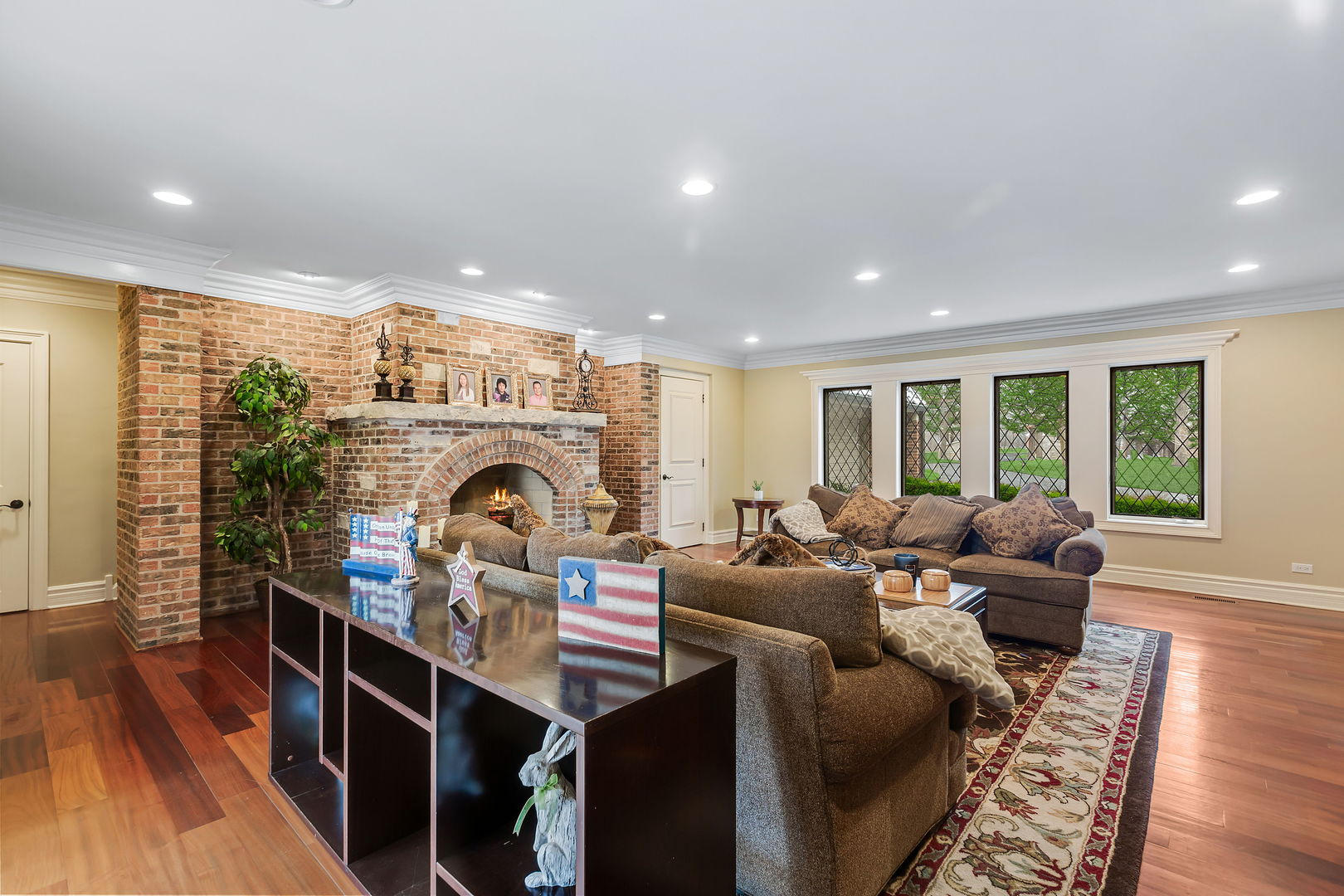 1560 South Ridge Road Lake Forest, IL 60045 - Photo 12 of 27 a living room with furniture a fireplace and wooden floor