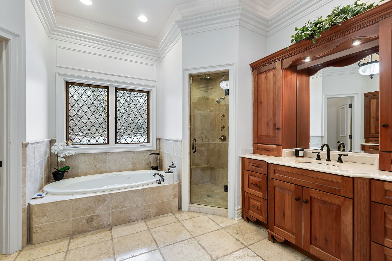 1560 South Ridge Road Lake Forest, IL 60045 - Photo 13 of 27 a spacious bathroom with a tub sink and mirror