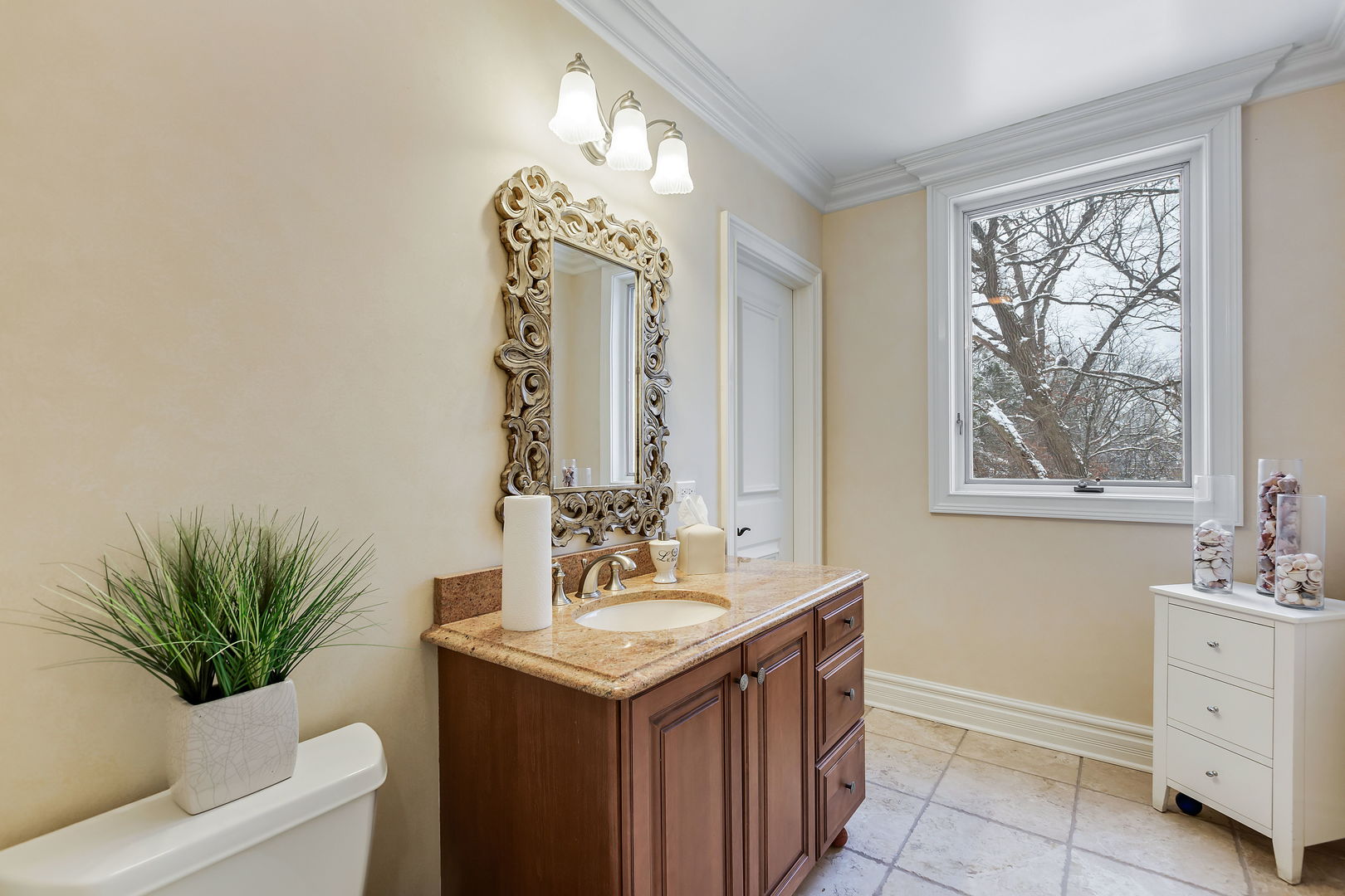1560 South Ridge Road Lake Forest, IL 60045 - Photo 19 of 27 a bathroom with a sink and a mirror