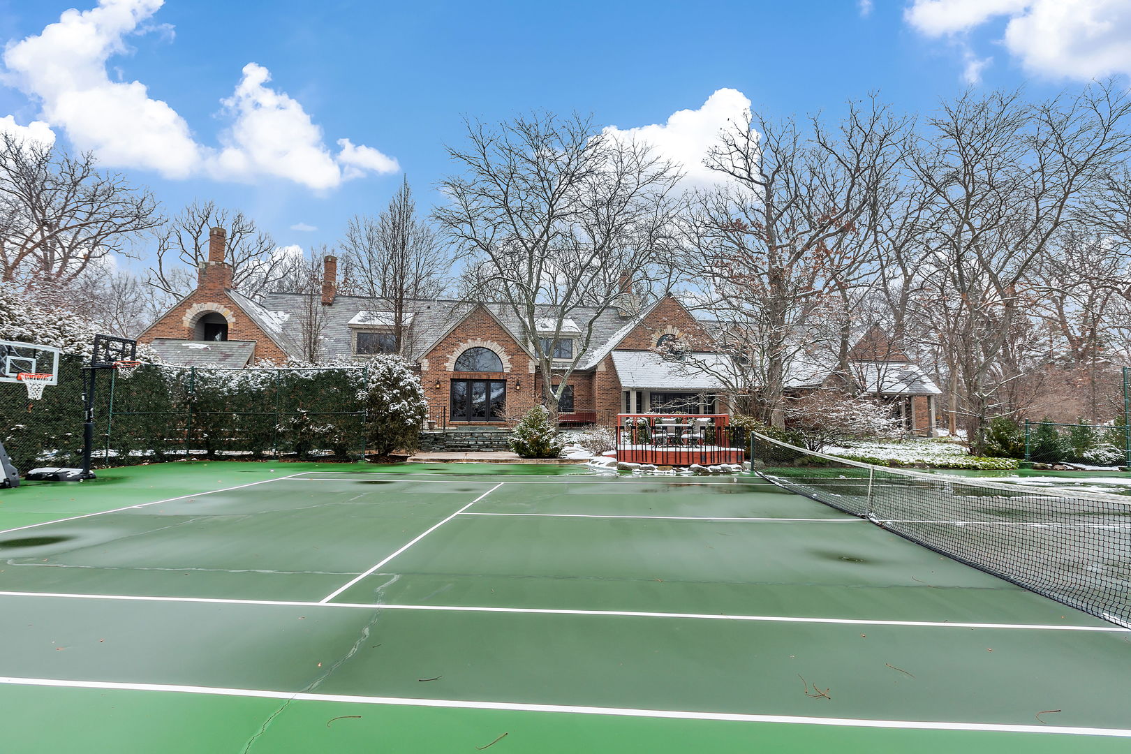 1560 South Ridge Road Lake Forest, IL 60045 - Photo 25 of 27 a view of a tennis ground with large trees