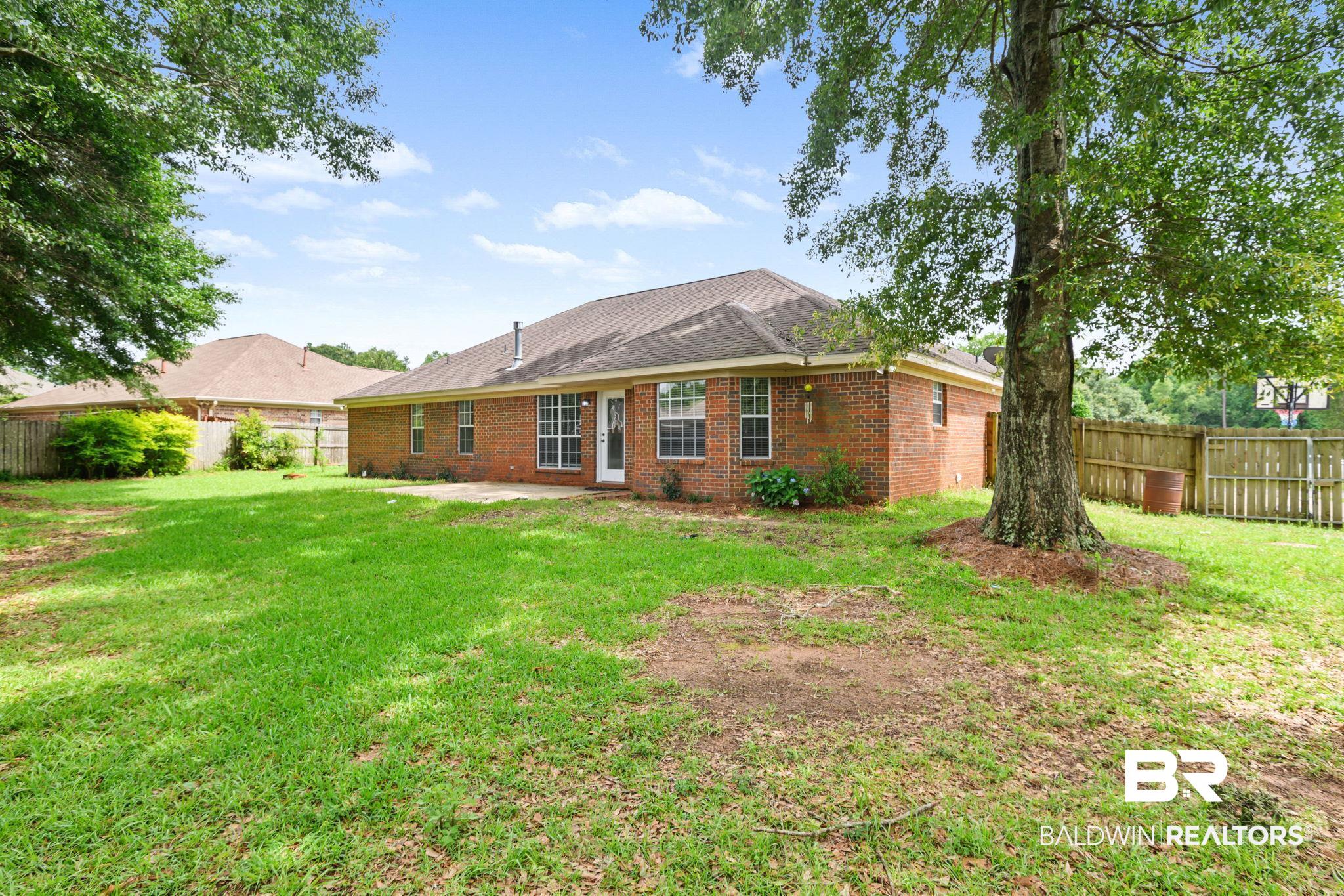9422 Labrador Run South Mobile, AL 36695 - Photo 32 of 36 Expansive green lawn providing ample outdoor space
