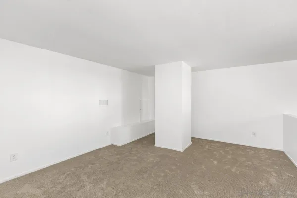 a view of a refrigerator in a white wall
