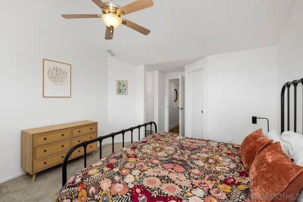 a bed room with a bed and a tv