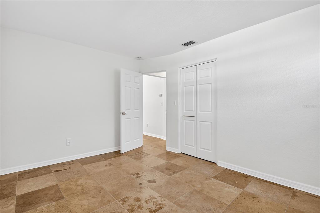 13440 1st Street East Madeira Beach, FL 33708 - Photo 26 of 44 a view of an empty room