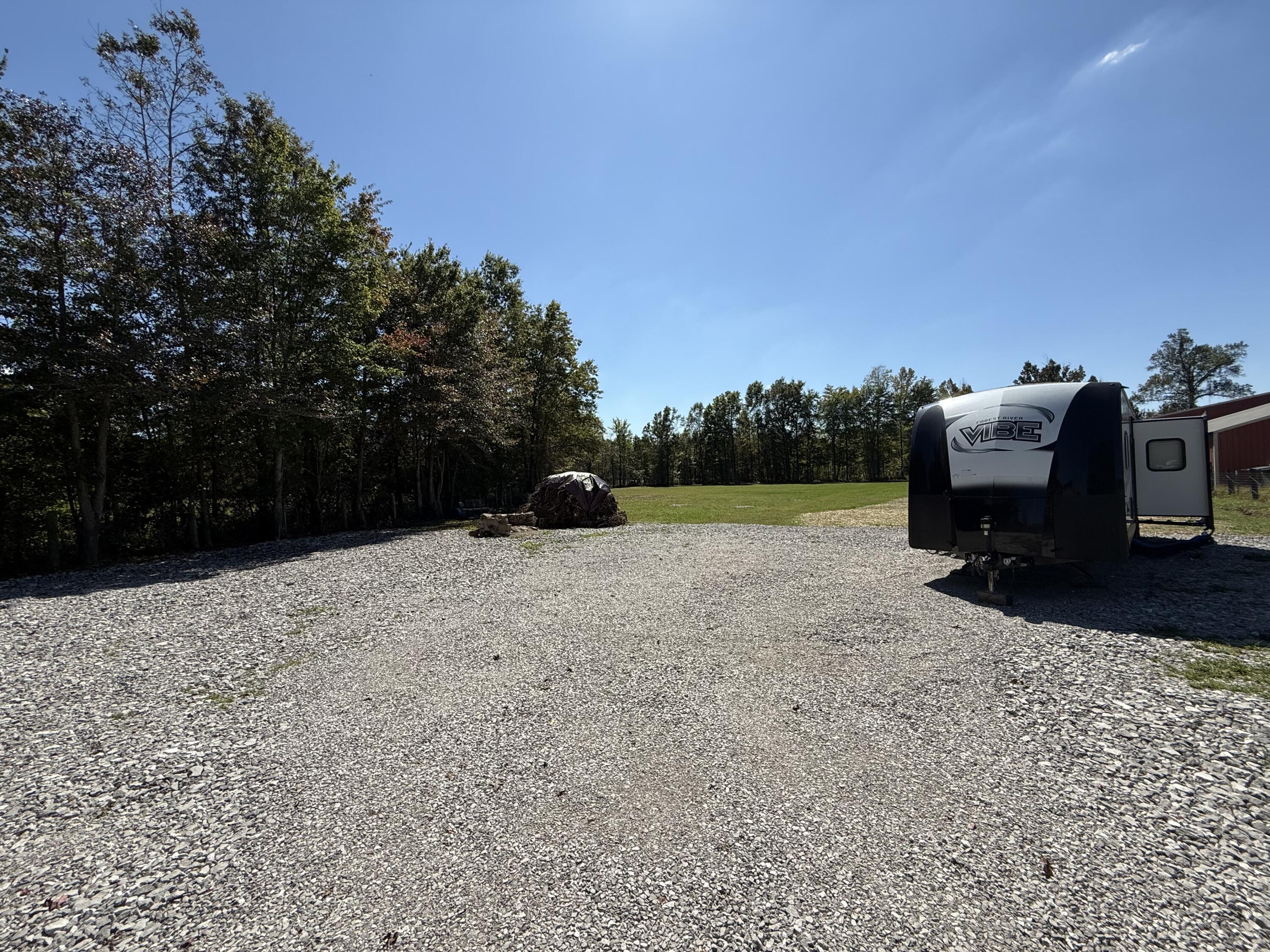 4386 South Laurel Road London, KY 40744 - Photo 5 of 35 Gravel Drive and parking area. Large grassy area in the back.