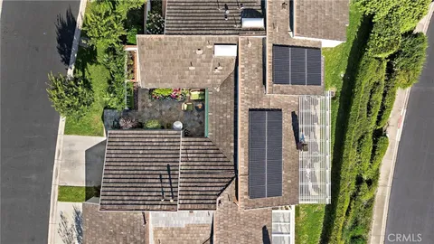 an aerial view of residential building and ocean
