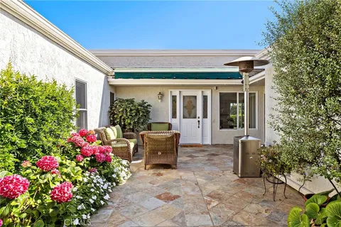 a front view of house with outdoor seating