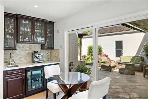 a living room with furniture and large windows
