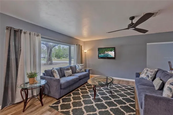 a living room with furniture and a window