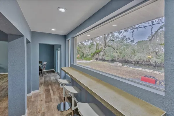 a room with a large window and couch
