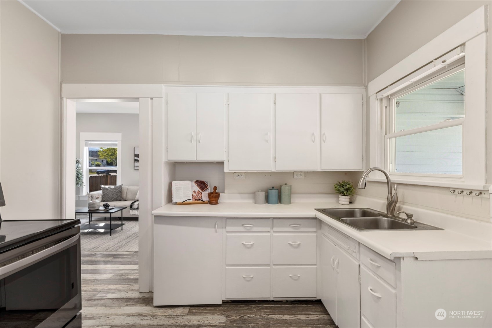 1702 Griffin Avenue Enumclaw, WA 98022 - Photo 12 of 27 a kitchen with white cabinets and sink