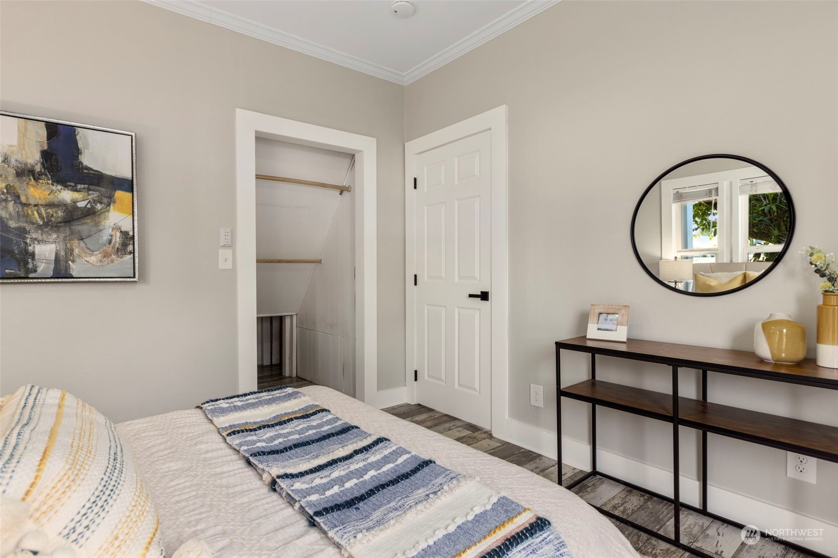 1702 Griffin Avenue Enumclaw, WA 98022 - Photo 17 of 27 a bedroom with a bed a mirror and a table in it