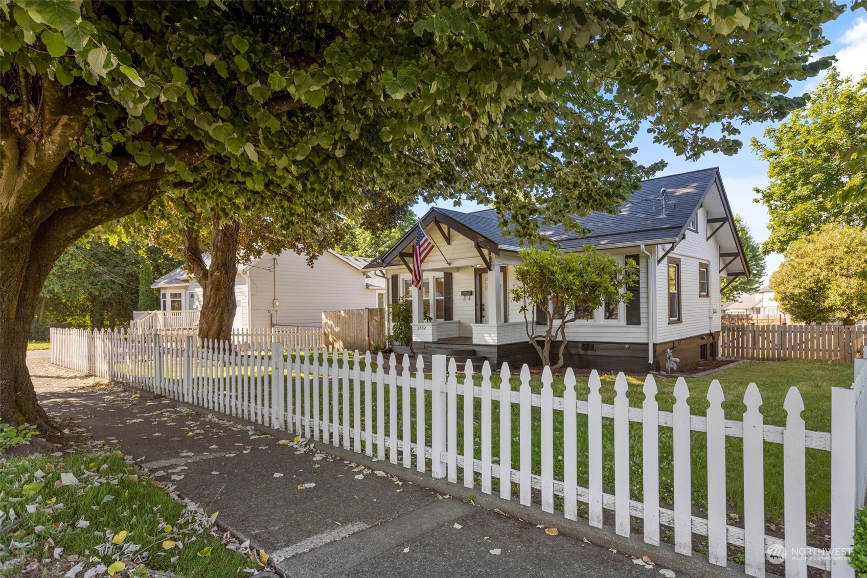 1702 Griffin Avenue Enumclaw, WA 98022 - Photo 2 of 27 a front view of a house with a garden