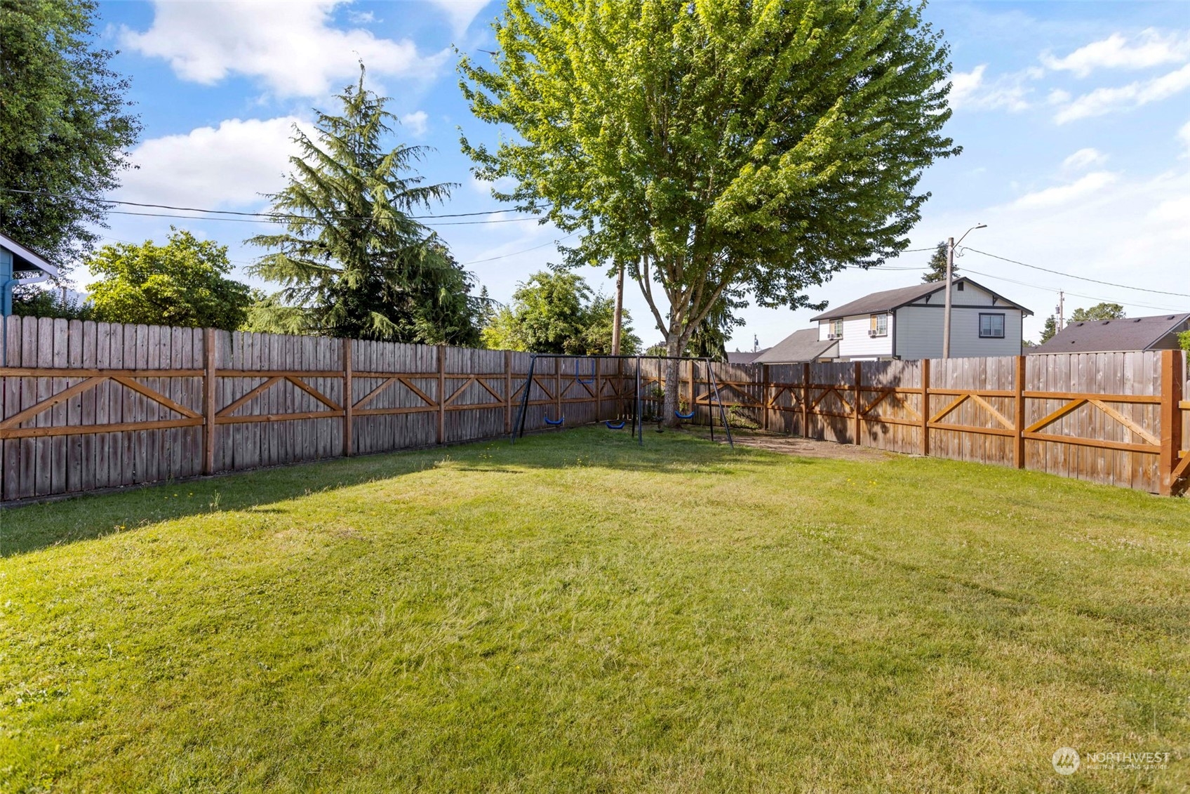 1702 Griffin Avenue Enumclaw, WA 98022 - Photo 23 of 27 a backyard of a house with lots of green space