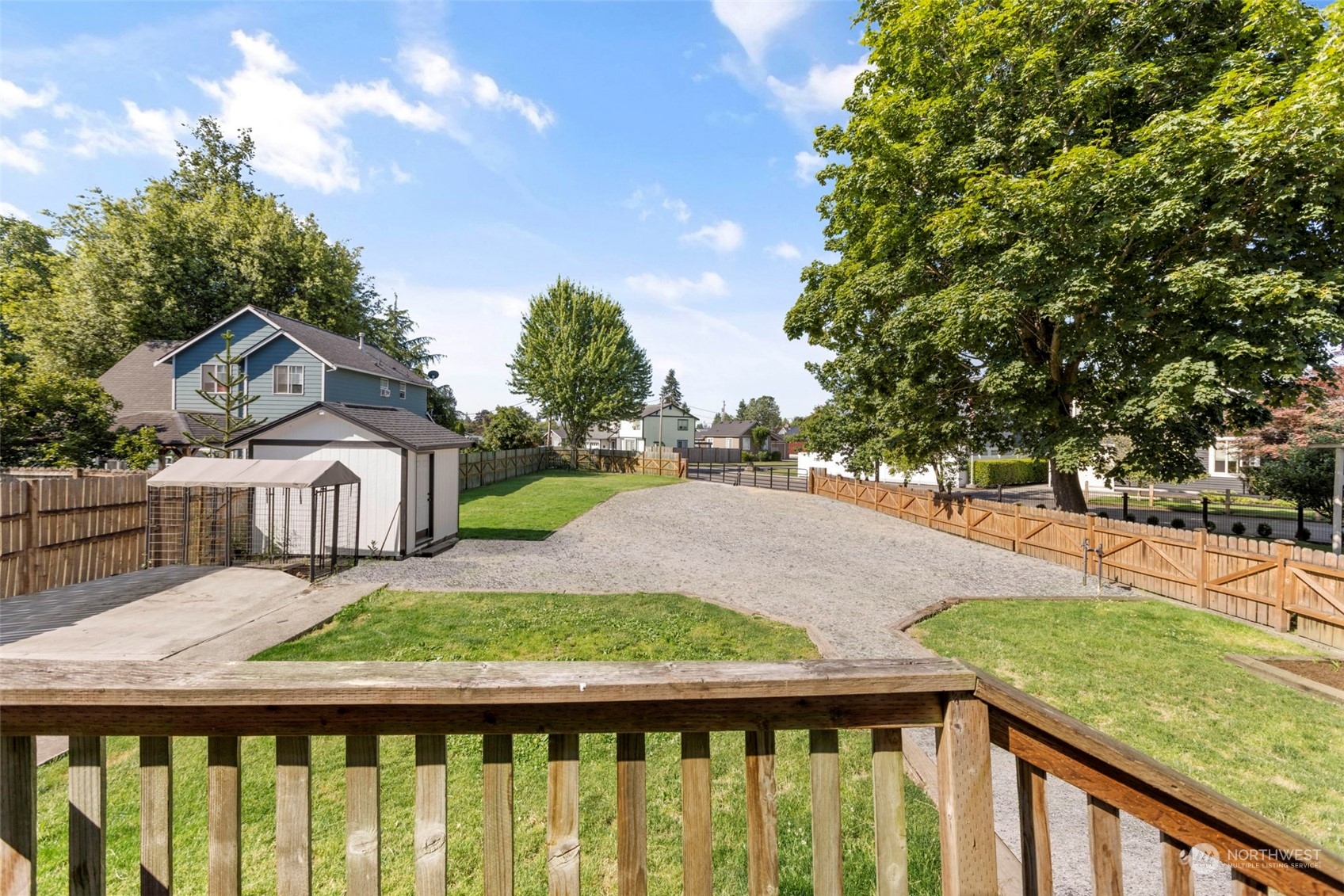 1702 Griffin Avenue Enumclaw, WA 98022 - Photo 24 of 27 a balcony with wooden floor and yard in the back