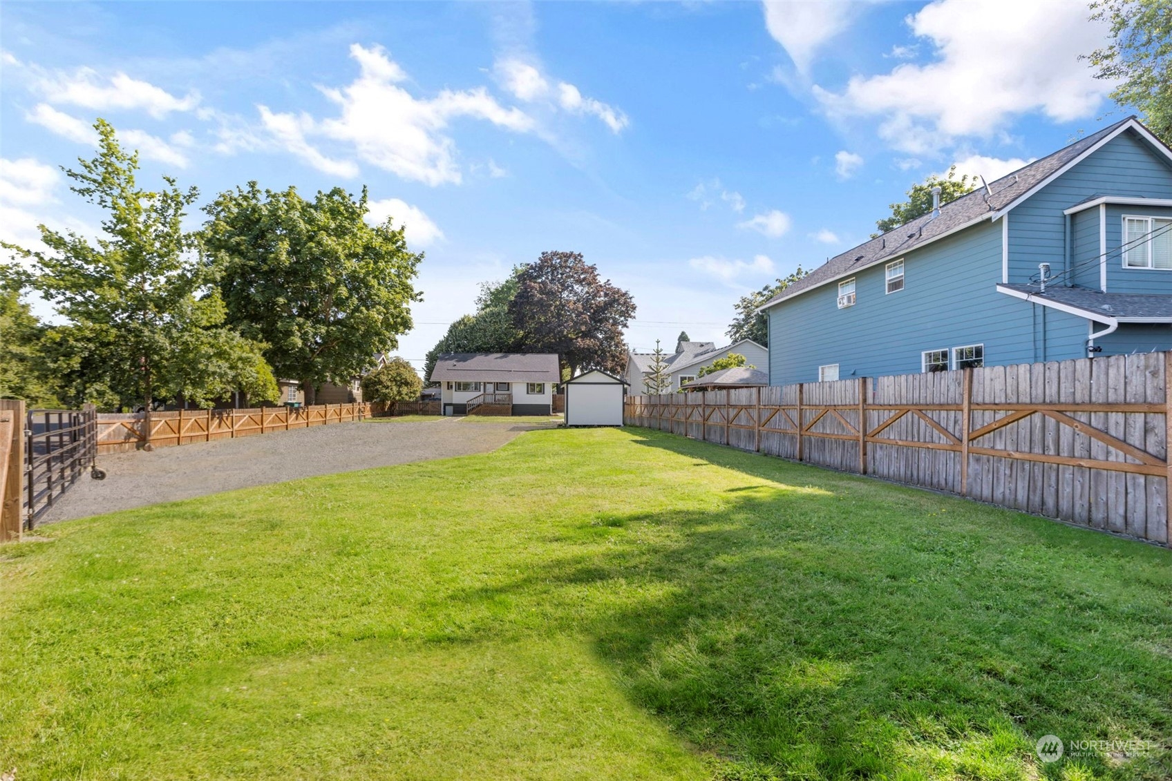 1702 Griffin Avenue Enumclaw, WA 98022 - Photo 4 of 27 a view of backyard with swimming pool and green space