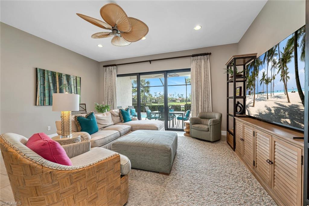 4741 Formosa Drive Naples, FL 34119 - Photo 11 of 18 a living room with furniture and a large window