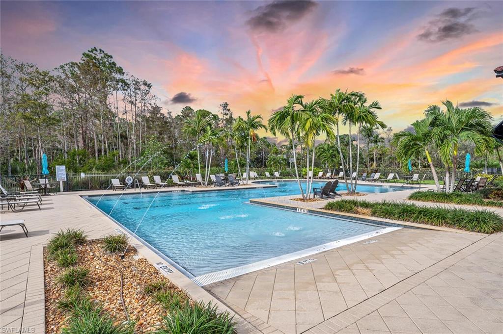 4741 Formosa Drive Naples, FL 34119 - Photo 18 of 18 a view of a swimming pool with an outdoor space and seating area