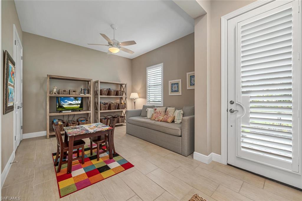 4741 Formosa Drive Naples, FL 34119 - Photo 4 of 18 a living room with furniture and a flat screen tv