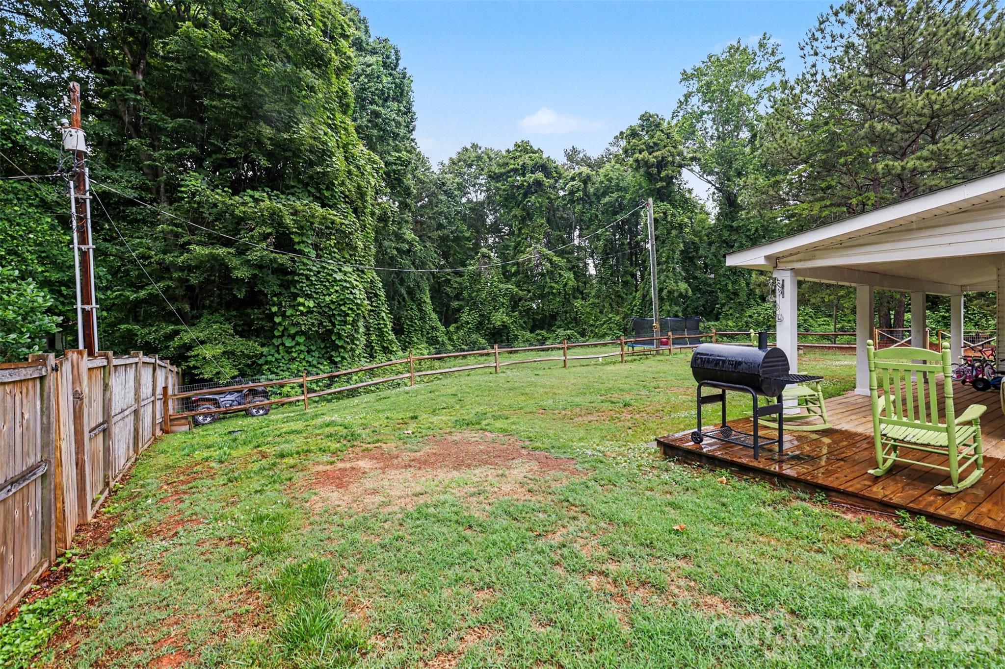 184 Canal Road Belmont, NC 28012 - Photo 11 of 39 a view of a table and chairs in the garden