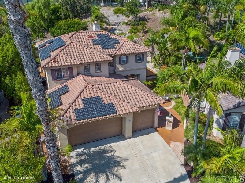 an aerial view of a house with a garden