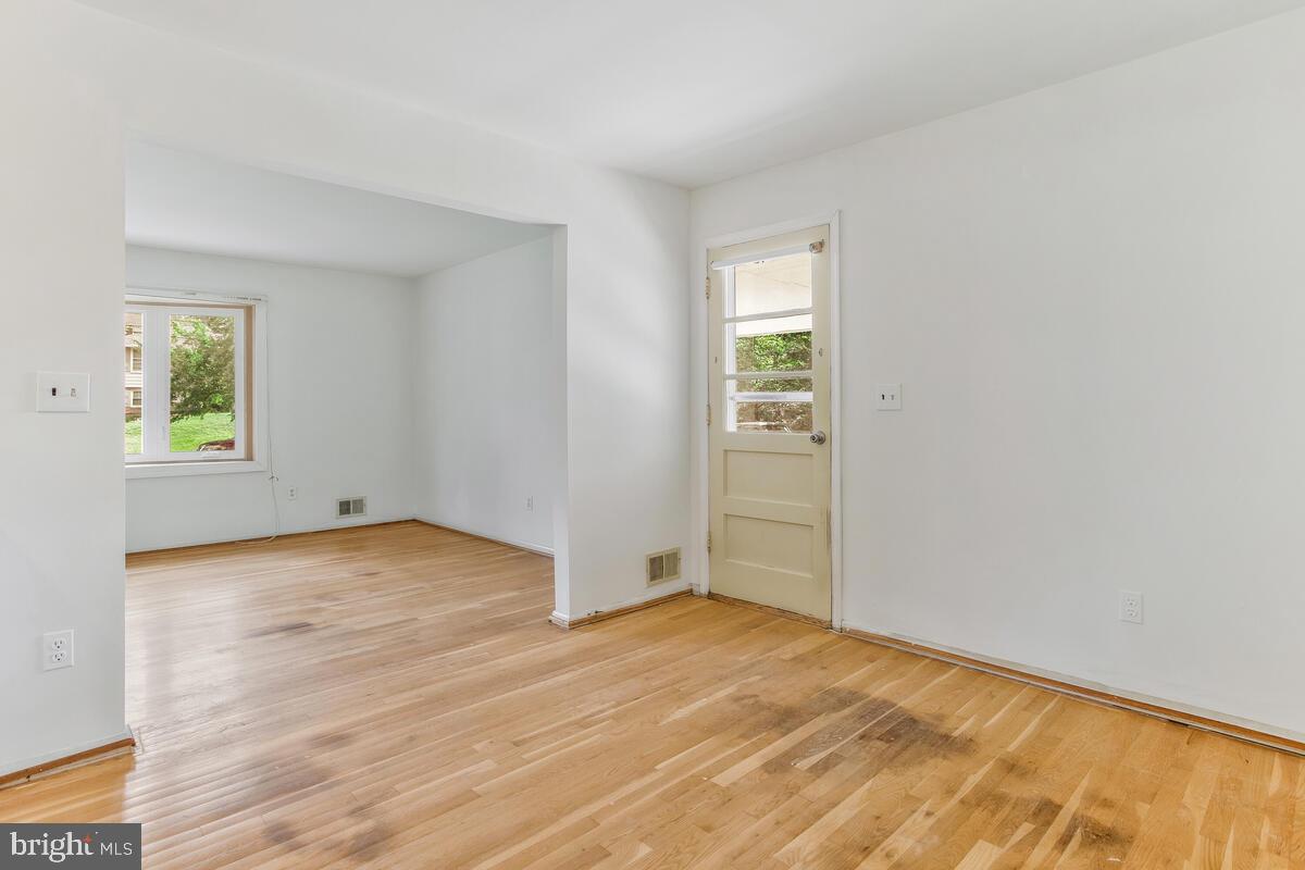 12412 Palermo Drive Silver Spring, MD 20904 - Photo 13 of 43 an empty room with wooden floor closet and windows